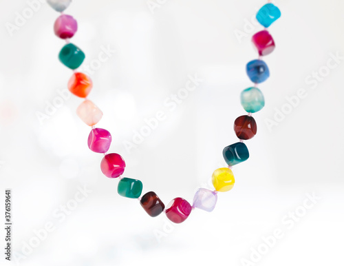 colorful stone necklace on white background