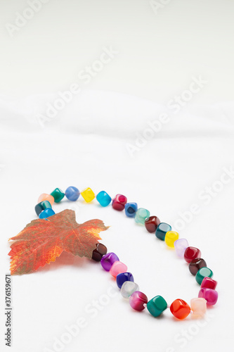 colorful stone necklace on white background
