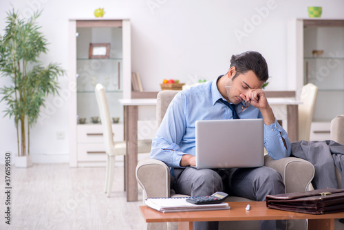 Tired businessman employee working from home