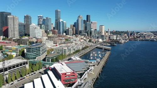 Aerial footage of the waterfront, Bell harbor marina in Seattle downtown, waterfront, piers, empty Alaskan Way with skyscrapers, during the pandemic