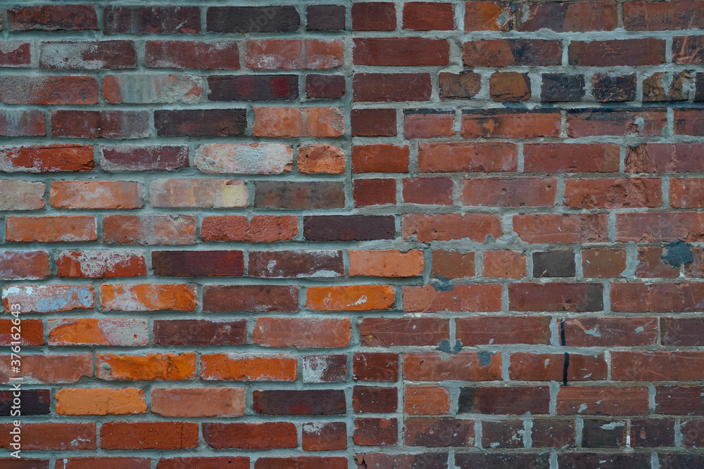 old rustic brick wall background with multi colored bricks and different sizes for old historic wall texture pattern old rustic brick wall background with multi colored bricks and different sizes for old historic wall texture pattern