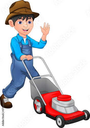 happy  boy is mowing the lawn with the lawn mower