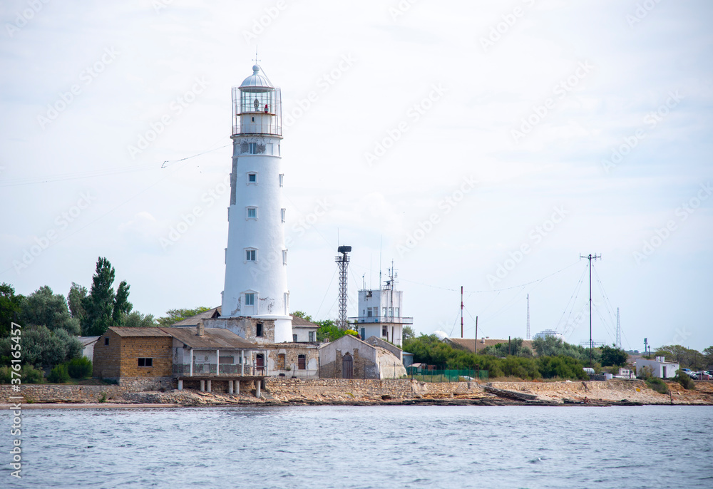  View of the old lighthouse from the sea.