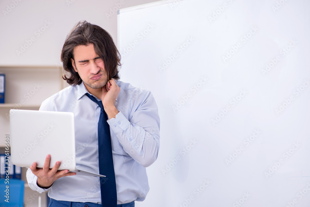 Young man employee in business presentation concept Young man employee in business presentation concept