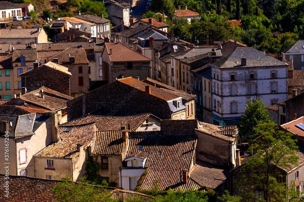 Beautiful top view of the French village of Laguepie. Old catholic cathedral. Orange tiled roofs. Beautiful top view of the French village of Laguepie. Old catholic cathedral. Orange tiled roofs.