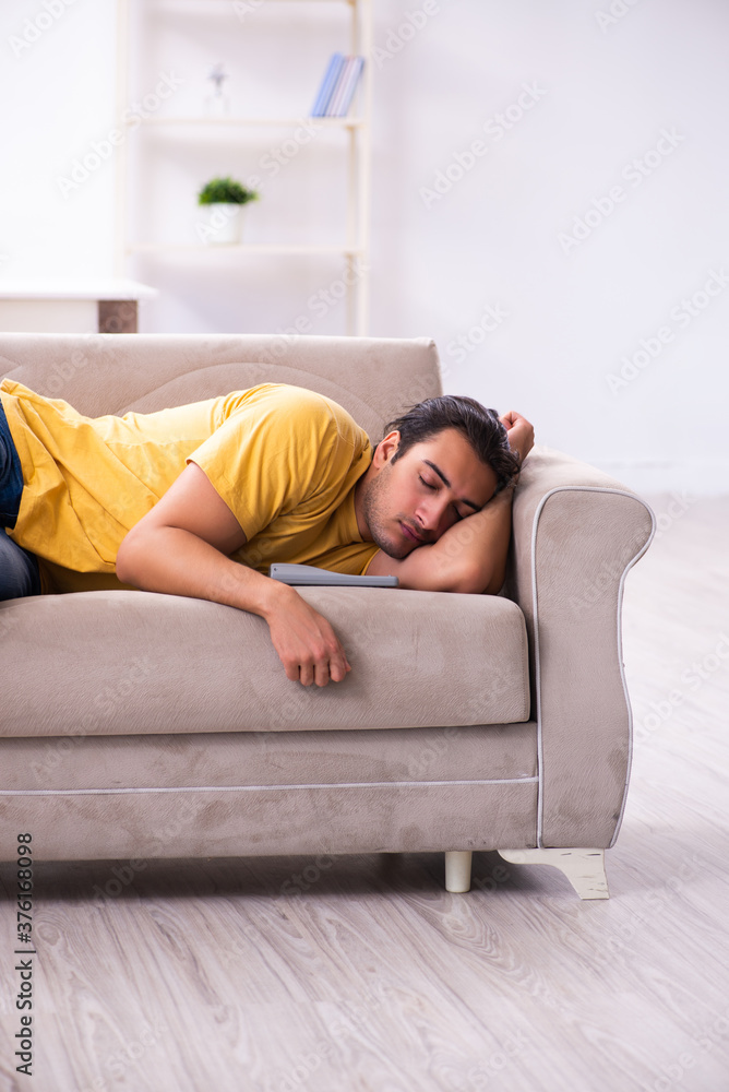 Young man watching tv at home Young man watching tv at home