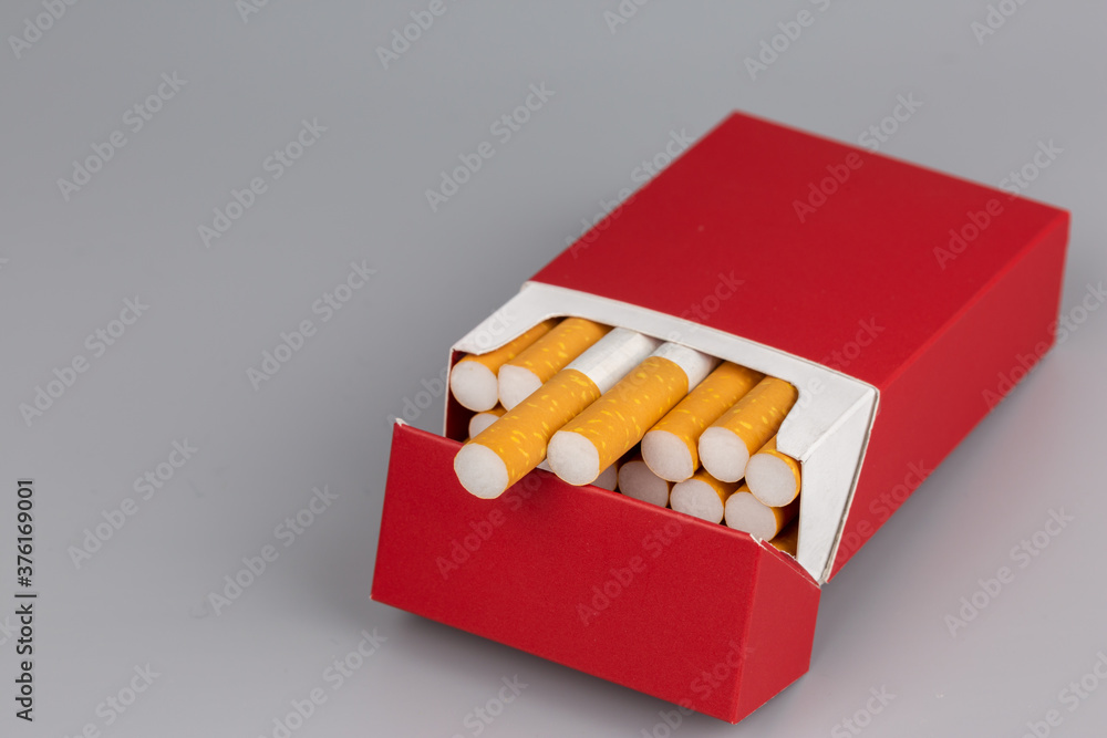 Close up cigarette in pack is addictive to be cancer.smoking reduction campaign in World No Tobacco Day. Close up cigarette in pack is addictive to be cancer.smoking reduction campaign in World No Tobacco Day.