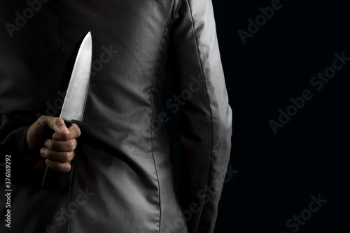Canvas Print businessman hide knife behind back