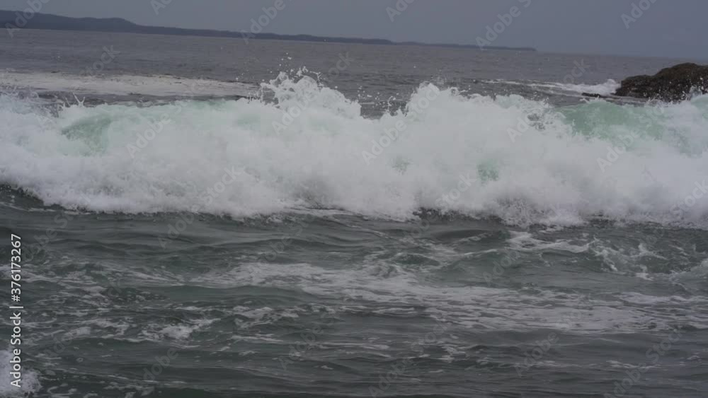Surf coming into shore on remote island.(slow motion)