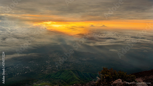 Ray of Light Sunlight Sunbeam through cloud formation Mountain Peak Morning View Indonesia Java Mountaineering Hobby Magnificent God Universe Earth Panorama Landscape Background Art Arts Grey Top Hill