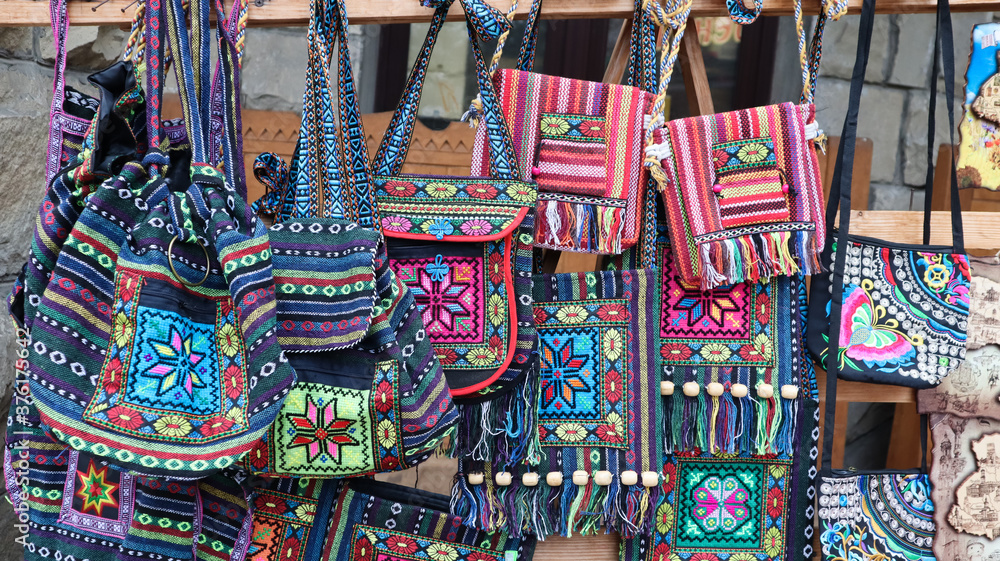 Souvenir market in Yaremche. Shoulder bags with ethnic Ukrainian designs are on sale in the Carpathians. 