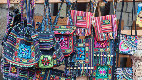 Souvenir market in Yaremche. Shoulder bags with ethnic Ukrainian designs are on sale in the Carpathians. 