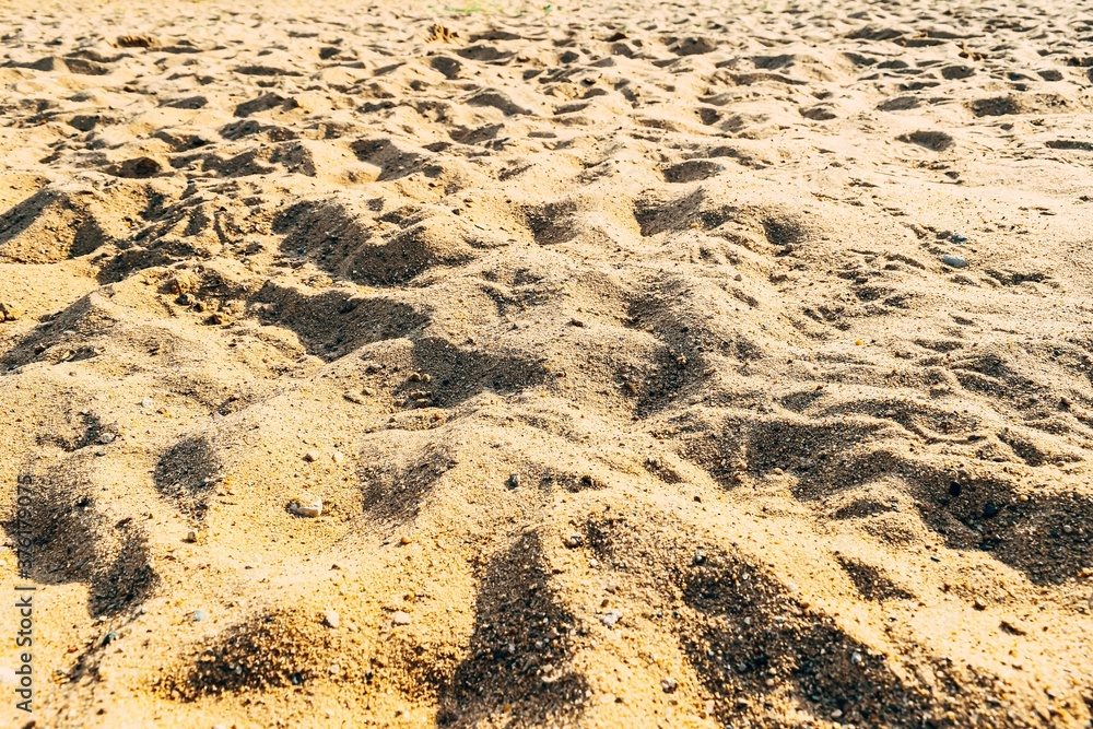 Sandy brown river beach. The concept of leisure and entertainment. Background Sandy brown river beach. The concept of leisure and entertainment. Background