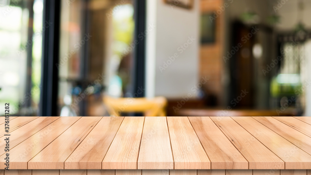 Empty wooden table top with lights bokeh on blur restaurant background Empty wooden table top with lights bokeh on blur restaurant background