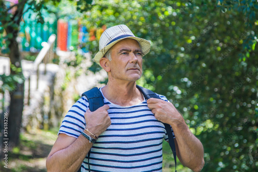 Obraz premium tourist with backpack walking through the countryside