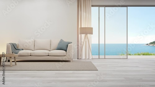 Beige sofa near blank wall on empty wooden floor of large living room in modern house or luxury hotel. Cozy home interior 3d rendering with beach and sea view.