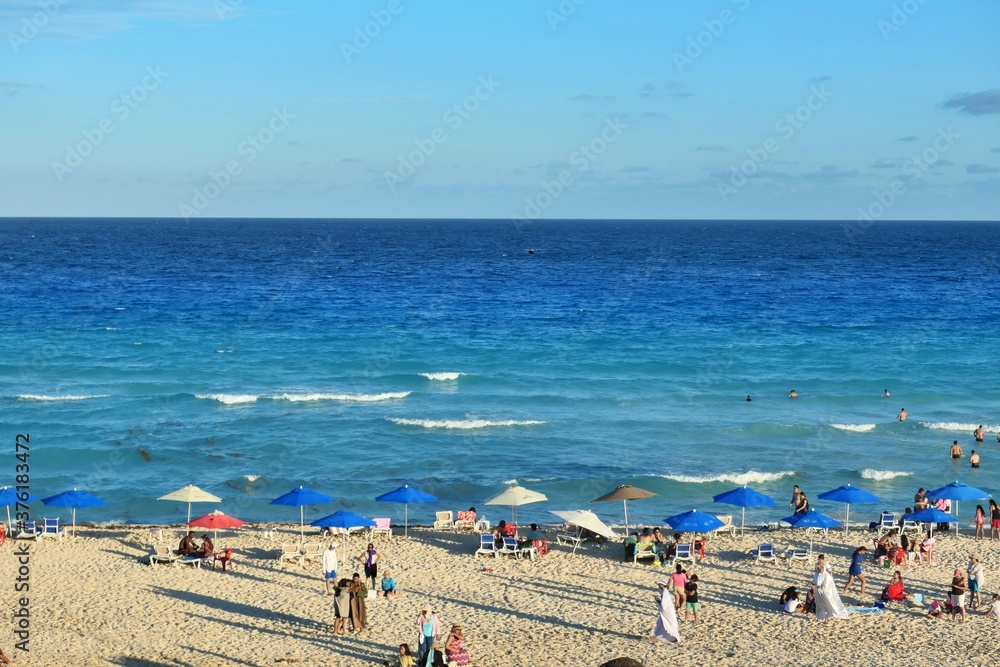 people walking on the beach