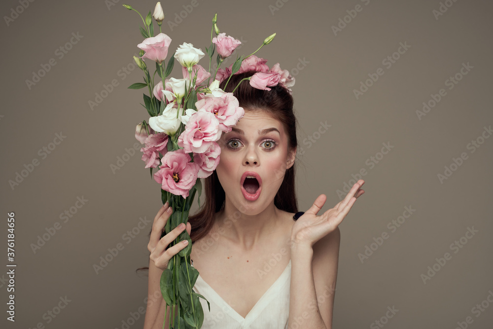 Pretty woman in white dress and bouquet of flowers decoration cosmetics lifestyle