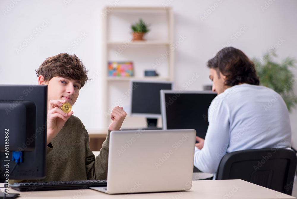 Father and son in criptocurrency concept Father and son in criptocurrency concept