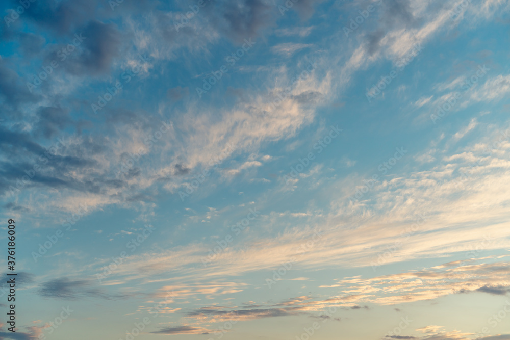 Fototapeta premium Blue sky with clouds before sunset, abstract natural background