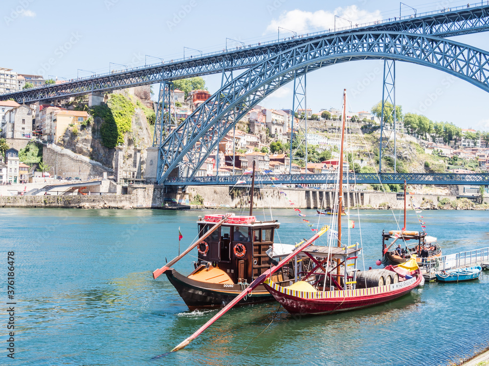 PORTO, PORTUGAL - JUNE 11, 2019: Luis I bridge and Douro river. It is the second-largest city in Portugal. It was proclaimed a World Heritage Site by UNESCO in 1996.