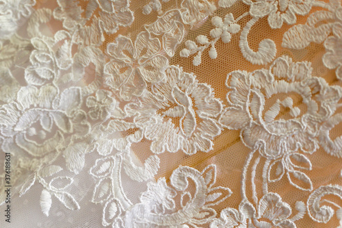 Floral pattern on a white wedding dress. 
