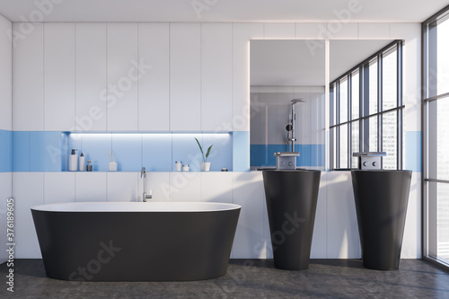White and blue bathroom interior  tub and sink