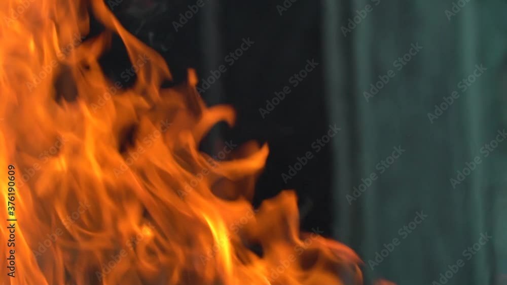 Slow-motion video of fire and flames.A fire pit, burning gas or gasoline burns with fire and flames.Flames and burning sparks close-up,fire patterns.A hellish glow of fire in the dark with copy space Slow-motion video of fire and flames.A fire pit, burning gas or gasoline burns with fire and flames.Flames and burning sparks close-up,fire patterns.A hellish glow of fire in the dark with copy space