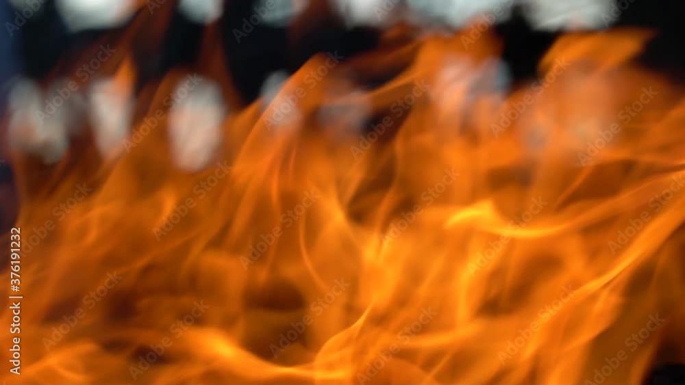 Slow-motion video of fire and flames.A fire pit, burning gas or gasoline burns with fire and flames.Flames and burning sparks close-up,fire patterns.A hellish glow of fire in the dark with copy space Slow-motion video of fire and flames.A fire pit, burning gas or gasoline burns with fire and flames.Flames and burning sparks close-up,fire patterns.A hellish glow of fire in the dark with copy space
