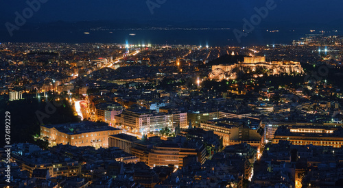 Night view of Athens and Acropolis with Parthenon, Hellenic Parliament and ruins of temple of Zeus. Famous iconic view of UNESCO world heritage site.