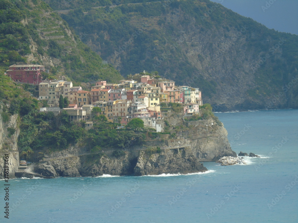 Cinque Terre, Italy - 08/31/2020: Beautiful landscape of a coastal fishing village, amazing view on many little colorful houses, traditional architecture of the little Italian town called Cinque Terre