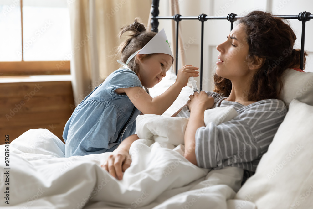 Caring daughter plays doctor treats sick mom by giving injection relief