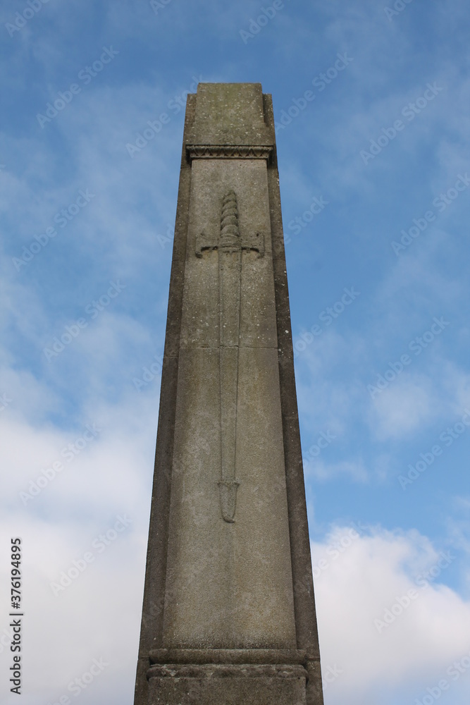 Upholland, Lancashire, UK, 06/09/2020: Close up of Upholland War Memorial obelisk with a sword in relief