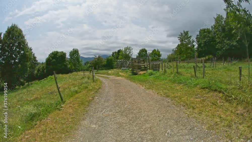 Walk to the farm in the mountains of the Pyrenees with clouds Walk to the farm in the mountains of the Pyrenees with clouds