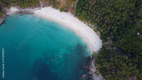 Aerial view. Top view of tropical island forest and white sand beach with turquoise sea water in Phuket, Thailand. Freedom beach.