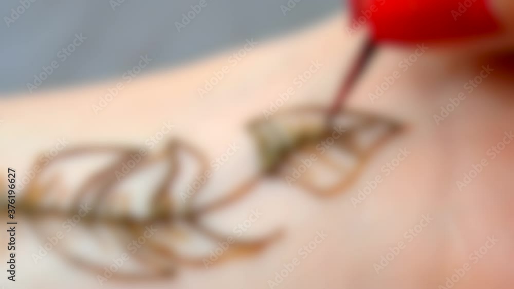 Blurred background. Mehendi, Henna application process, painting mehendi, Blurred background. Mehendi, Henna application process, painting mehendi,