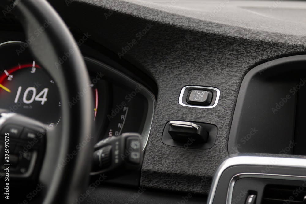 Car front panel with start button and speedometer reading