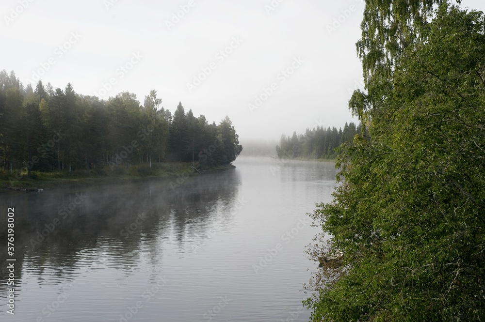 A foggy morning near a river early september in the Vansbro kommun in Dalarna,Sweden.
