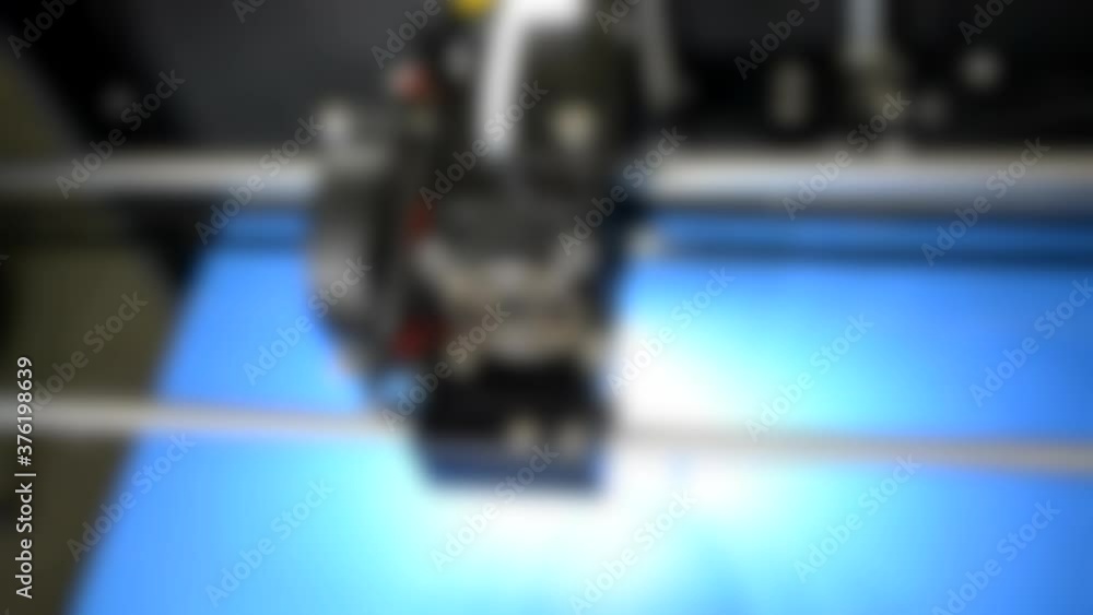 Blurred background. 3D printer with a backlit. Blurred background. 3D printer with a backlit.