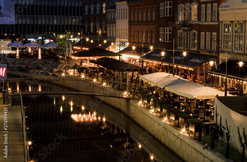 River in Aarhus with café at night time, evening. Boardwalk in Århus.