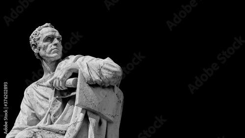 Senator of Ancient Rome. The great orator Lucius Licinius Crassus old marble statue in front of Old Palace of Justice in Rome (Black and White with copy space)