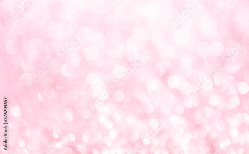 Pink background. White glitter blur vintage lights background. Bokeh silver and white. de-focused copy space.