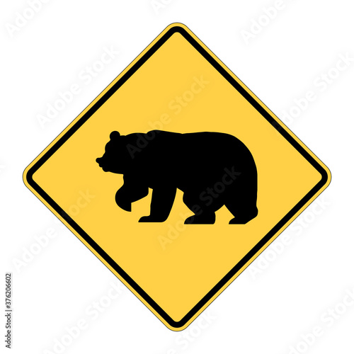 Bear crossing warning road sign. Caution big animals. Vector illustration of yellow diamond shaped traffic sign with bear icon inside. Risk of collision. Wildlife on road symbol.