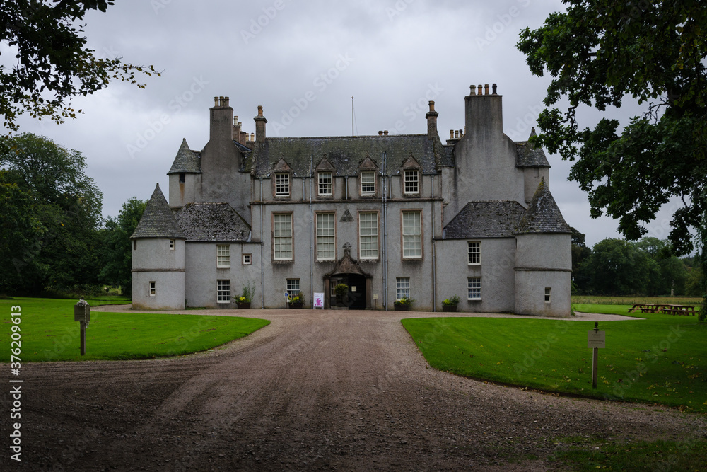 View of Leith Hall Castle among the trees on a cloudy day, Scotland, United Kingdom View of Leith Hall Castle among the trees on a cloudy day, Scotland, United Kingdom