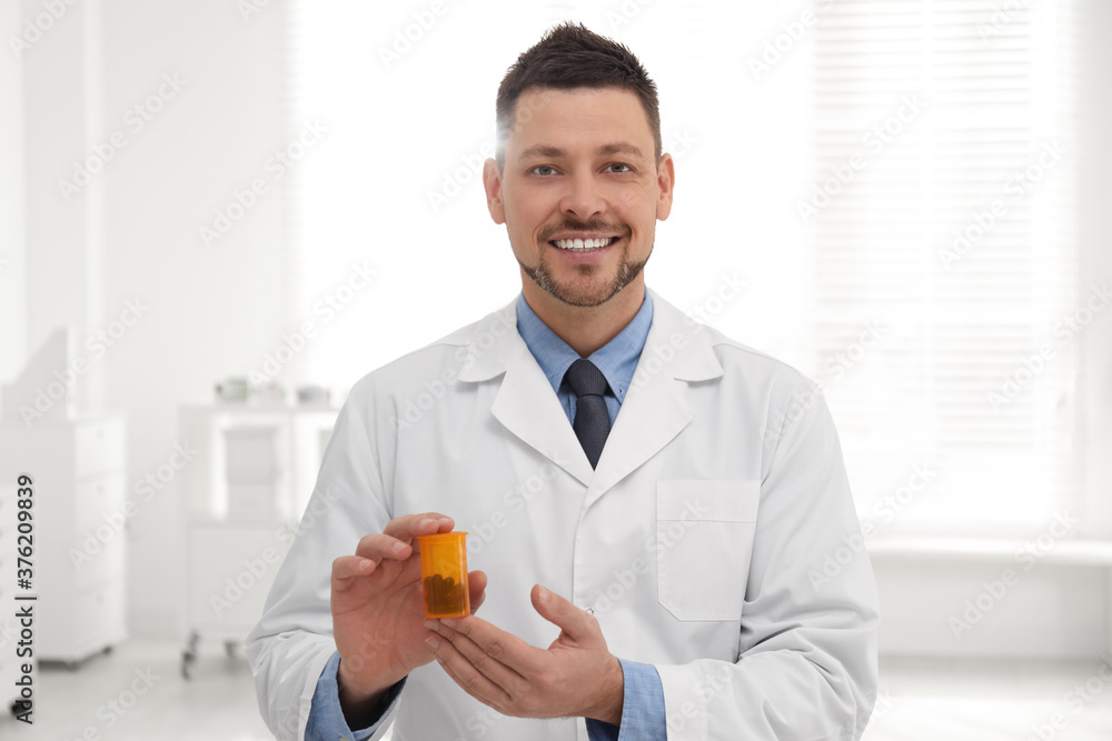 Portrait of professional pharmacist with pills in drugstore Portrait of professional pharmacist with pills in drugstore