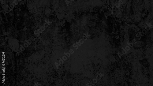 old weathered cement wall background in dark black color. rustic grunge and dirty wall for abandoned concept background. stucco concrete wall texture.