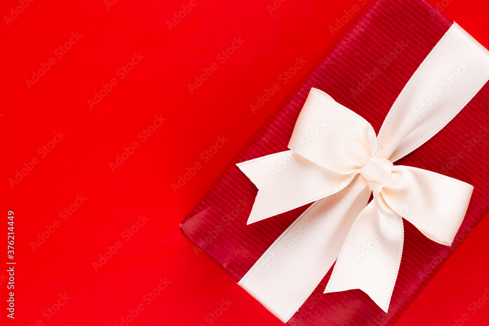 Christmas gift boxes with ribbons on red tabletop. Christmas gift boxes with ribbons on red tabletop.