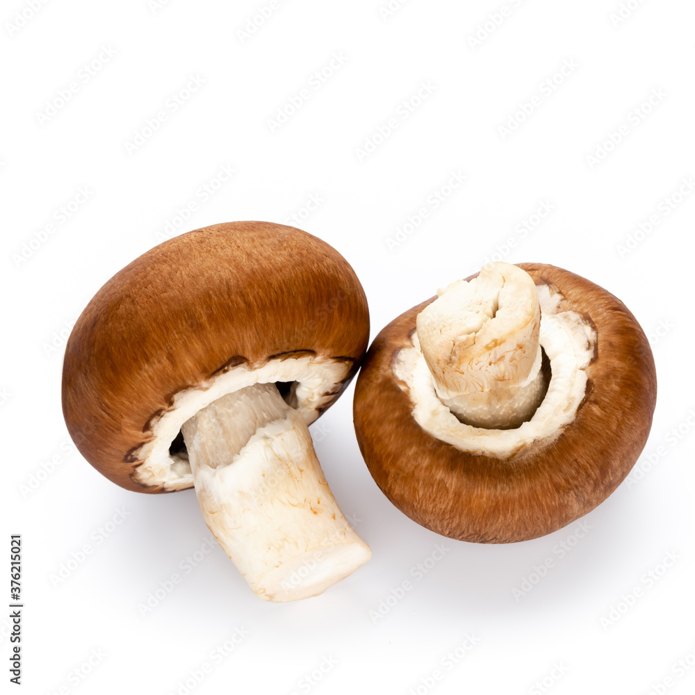 Fototapeta premium Fresh champignon mushrooms isolated on white.