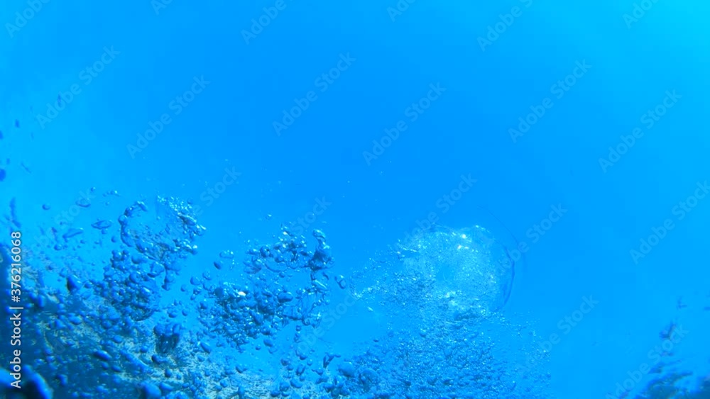 Exhaled air bubbles travel to the surface. Underwater view. Concept of drowning. Diving under the water. Slow motion Exhaled air bubbles travel to the surface. Underwater view. Concept of drowning. Diving under the water. Slow motion