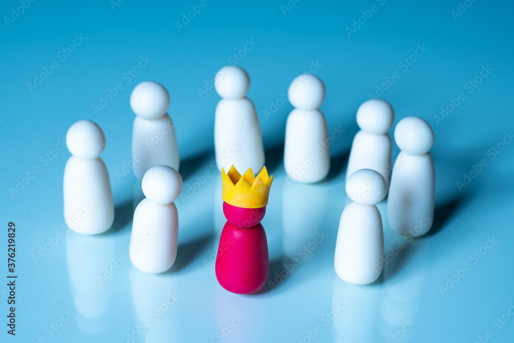The concept of teamwork on a blue background. Round dance of symbolic men. Joint activities under the guidance of the boss. Combining employees to achieve common goals. The concept of teamwork on a blue background. Round dance of symbolic men. Joint activities under the guidance of the boss. Combining employees to achieve common goals.